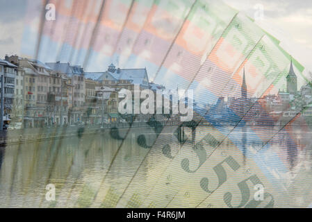 Zurich with the river and swiss franc banknotes in Switzerland. Stock Photo