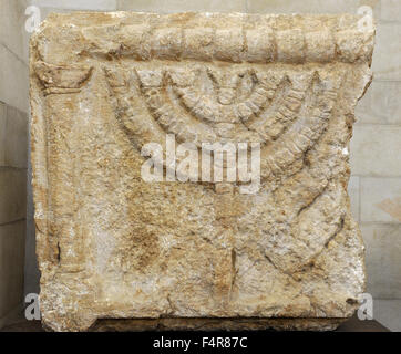 Stone lintels decorated with the Seven-Branched Menorah synagogue at Eshtemoa. Southern Hebron hill region. 3rd-4th century CE. Rockefeller Archaeological Museum. Jerusalem. Israel.