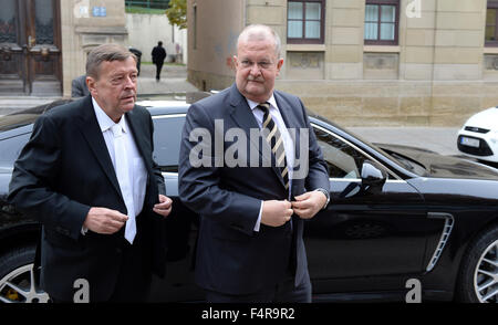 Stuttgart, Germany. 22nd Oct, 2015. Former CEO of Porsche Automobil Holding SE, Wendelin Wiedeking (R), gets out of a Porsche Panamera with his lawyer Hanns Feigen (L) en route to trial in the regional court in Stuttgart, Germany, 22 October 2015. The former head of Porsche is being accused in connection with the planned but unsuccessful takeover of VW market manipulation. Photo: BENRD WEISSBROD/dpa/Alamy Live News Stock Photo