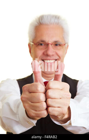 Old happy man holding thumbs up in a retirement home Stock Photo - Alamy