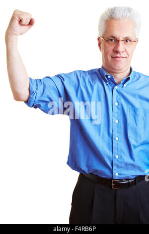 Senior citizen flexing his upper arm muscles Stock Photo