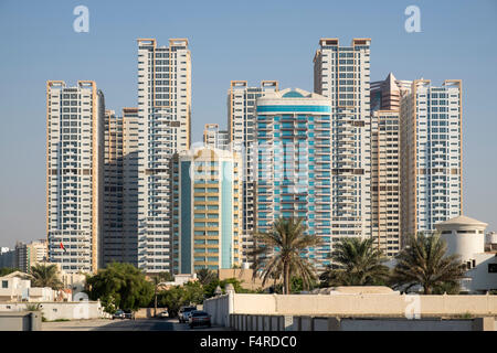 View of modern high-rise residential apartment blocks in Ajman Emirate in United Arab Emirates Stock Photo