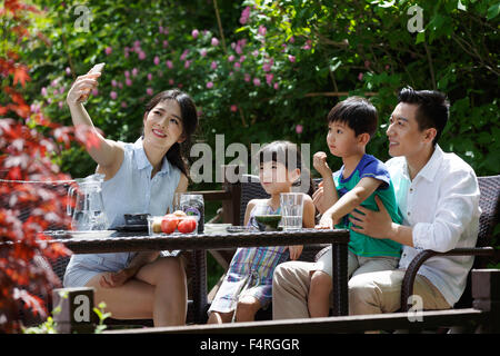 Happy family in the afternoon tea Stock Photo