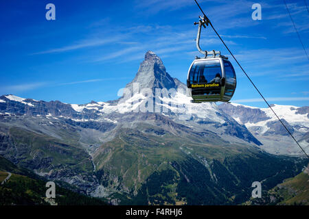 A cable car soars past Matterhorn peak. July, 2015. Matterhorn, Switzerland. Stock Photo