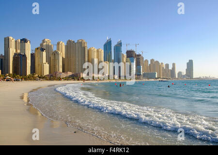 View of skyline of modern skyscrapers and beach at Marina district of Dubai United Arab Emirates Stock Photo