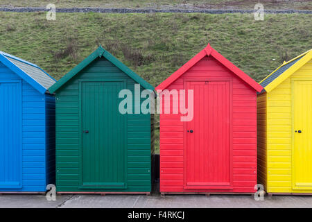 Brightly Coloured Beach Huts Whitby North Yorkshire UK Stock Photo