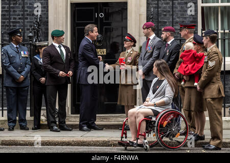 London, UK. 22nd October, 2015. Royal British Legion Poppy Appeal annual launch with parade passing through London delivering the first poppy to Prime Minister David Cameron at Downing Street Credit:  Guy Corbishley/Alamy Live News Stock Photo