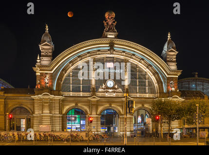 Total lunar eclipse above central station entrance, Frankfurt am Main, Hesse, Germany Stock Photo