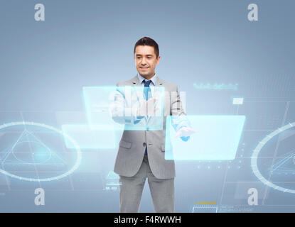 businessman in suit working with virtual screens Stock Photo