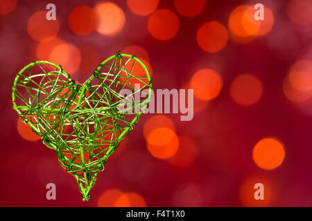 heart from metal on the red background Stock Photo