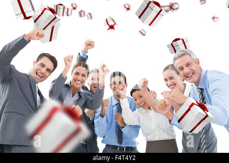 Composite image of business people cheering in office Stock Photo