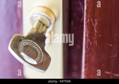 A high security key in a Yale high security TS007 one star 1* security lock. Stock Photo