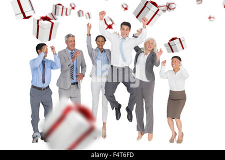 Composite image of business people cheering in office Stock Photo