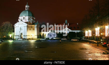 New Town Market in Old Town district in Warsaw, Poland, at night with st. kazimierz church Stock Photo