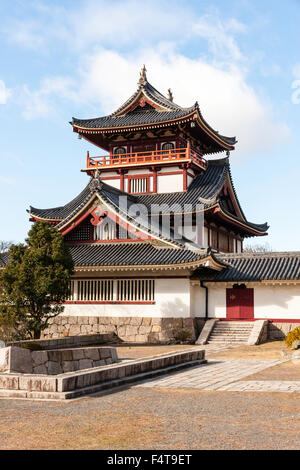 Japan, Kyoto, Fushimi castle, also known as Momoyama castle. Built as a Castle Entertainment Park in 1964. Castle yagura, turret with Japanese trees. Stock Photo