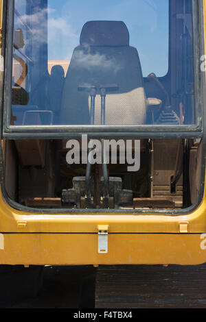 Excavator Driver's Cabin at Construction Site Stock Photo