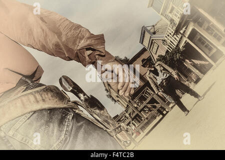 Cowboy pistol duel at Texas Hollywood/Fort Bravo western-styled theme park.  Almeria. Spain Stock Photo
