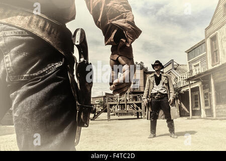 Cowboy pistol duel at Texas Hollywood/Fort Bravo western-styled theme park.  Almeria. Spain Stock Photo