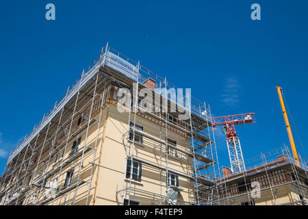 France, Europe, Perpignan, town, city, house, home, renovating, crane, construction, renovation, renovate Stock Photo