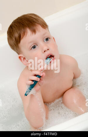 Three years child is brushing teeth Stock Photo