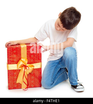 boy with red gift box and golden bow - holiday object concept isolated Stock Photo