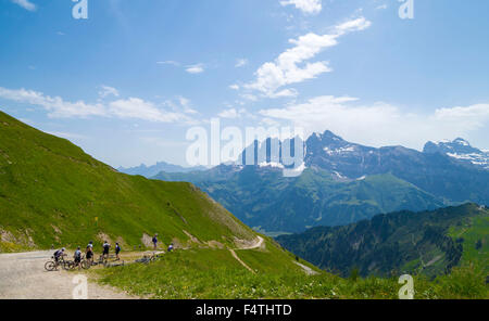 Bikers on the trail in Swiss Alps ,Portes du Soleil region touristic. Stock Photo