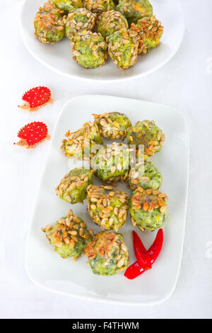 Spinach dumplings with sunflowers Stock Photo
