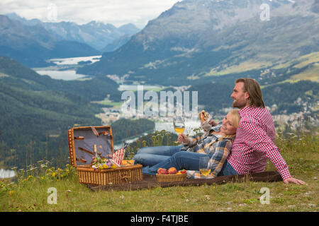 Couple, near picnic on Muottas Muragl, Stock Photo