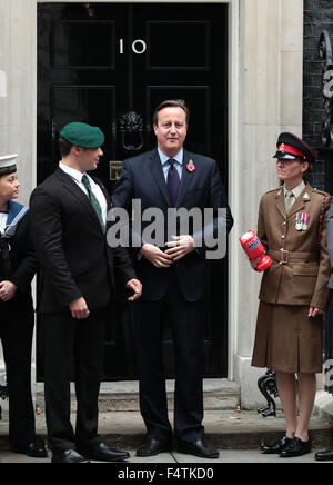 London, UK. 22nd October, 2015. Prime Minister David Cameron buys his remembrance poppy from Corporal Linda for this years Poppy Stock Photo