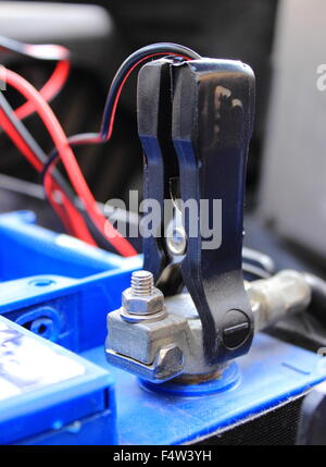 Charger with cables uses to charge old dead car battery Stock Photo