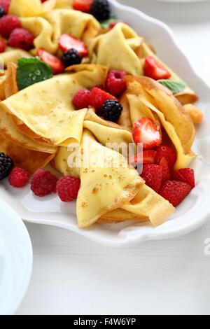 hot crepes with berry mix, closeup Stock Photo