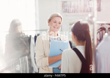 Fashion designers talking in office Stock Photo