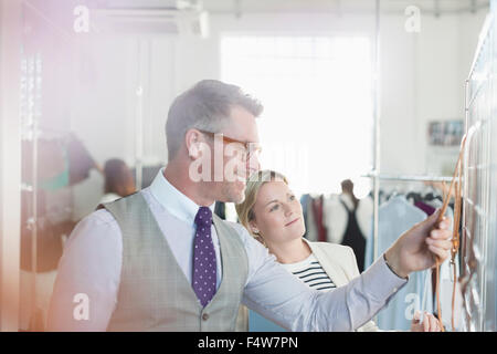 Fashion designers brainstorming at whiteboard in office Stock Photo