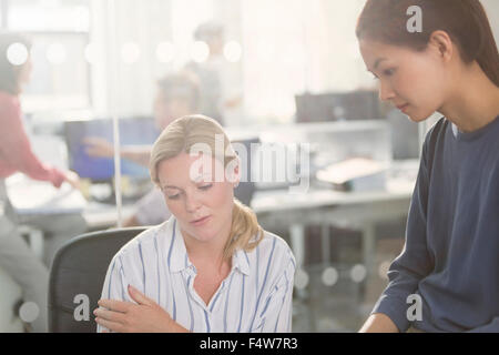 Businesswomen working in office Stock Photo