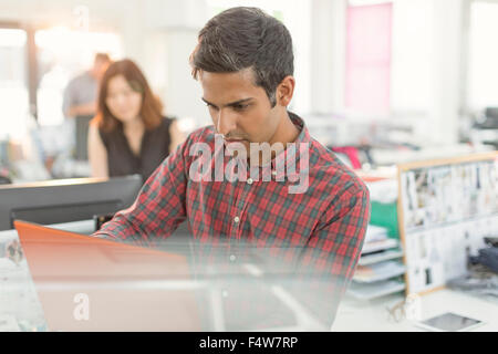Focused businessman working in office Stock Photo