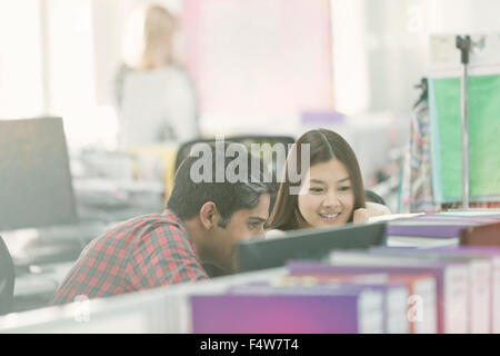 Fashion designers working at computer in office Stock Photo