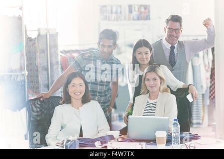 Portrait confident fashion designers meeting in office Stock Photo