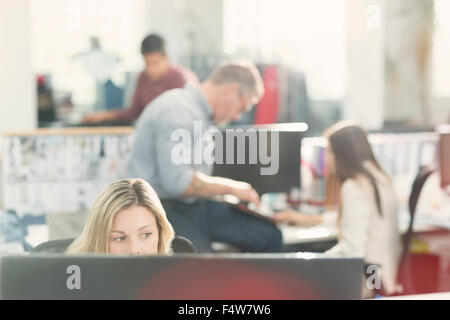 Fashion designers working in office Stock Photo