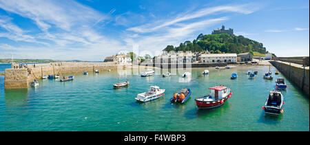 A 2 picture stitch panoramic view of St Michael's Mount with the harbour and village in the foreground. Stock Photo