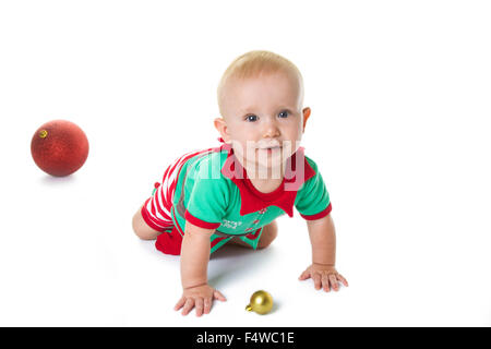 Little baby boy dressed in Elf costume, playing on the floor. Stock Photo