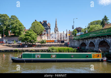 Narrowboat on the River Trent traveling under the town bridge in Newark-on-Trent. Side view. Nottinghamshire England UK Stock Photo
