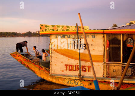 Dragon boat cuise on the river Huong (Perfume River). Vietnam. Dragon head and excursion boat, Song Huong or Huong Giang or Perfume River, near Hue, North Vietnam, Vietnam, Southeast Asia. Stock Photo