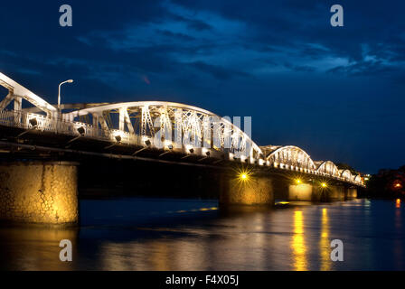 Illuminated Trang Tien Bridge over Perfume River, Hue, Vietnam. Bridge lit up at dusk, Trang Tien Bridge, Perfume River, Hue, Vietnam. Stock Photo