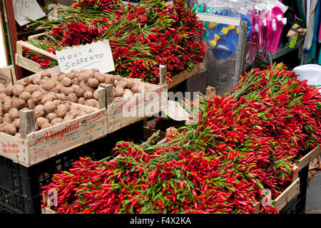 Chilli peppers and walnuts for sale, street market, Sorrento, Italy Stock Photo