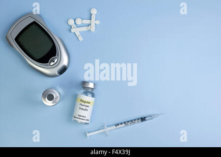 Diabetes supplies background on light blue with copyspace. Stock Photo