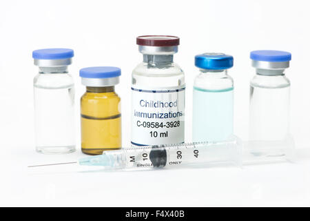 Childhood vaccine with various vials and syringe.  Label is fictitious and bears no resemblance to any actual product. Stock Photo