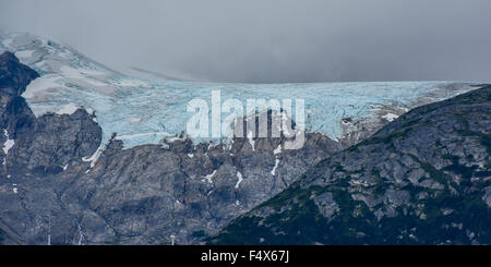 Hanging glaciers and clouds on the mountain tops near port of Skagway Alaska | Lynn Canal fjord cruise - inside passage Stock Photo