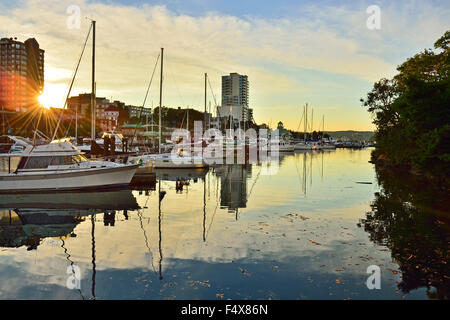A peaceful landscape image of the boats moored at the harbour in Nanaimo B.C. at sunset. Stock Photo