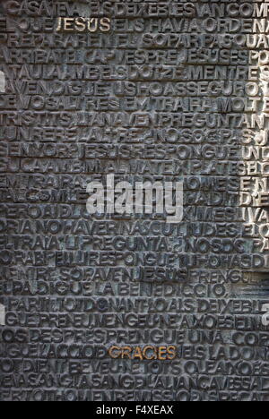 Bronze main door of La Sagrada Familia, the cathedral designed by Gaudi. Architectural detail depicting words in relief. Stock Photo