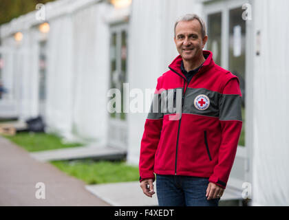 Duesseldorf, Germany. 22nd Oct, 2015. Herbert Spies, German Red Cross (DRK) media coordinator for refugee matters stands in front of the refugee shelter in Borbecker Strasse in Duesseldorf, Germany, 22 October 2015. Photo: Monika Skolimowska/dpa/Alamy Live News Stock Photo